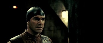 Movie still from “Hostel: Part II” (2007), directed by Eli Roth – A person wearing a helmet; Close Up shot, Over the shoulder angle