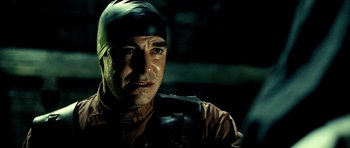 Movie still from “Hostel: Part II” (2007), directed by Eli Roth – A person with a helmet on; Close Up shot, Over the shoulder angle