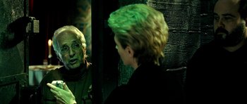 Movie still from “Hostel: Part II” (2007), directed by Eli Roth – A man and a woman looking at each other in a mirror; Close Up shot, Over the shoulder angle