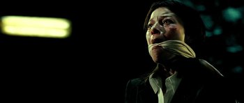 Movie still from “Hostel: Part II” (2007), directed by Eli Roth – A woman with tape over her mouth and nose; Close Up shot, Low angle