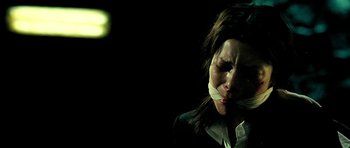 Movie still from “Hostel: Part II” (2007), directed by Eli Roth – A woman with a tape over her mouth and nose; Close Up shot, Low angle