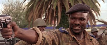 Movie still from “Hotel Rwanda” (2004), directed by Terry George – A man in a military uniform with a hat on; Close Up shot, Low angle