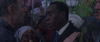 Movie still from “Hotel Rwanda” (2004), directed by Terry George – A person holding an umbrella; Close Up shot, Low angle