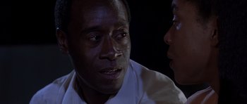 Movie still from “Hotel Rwanda” (2004), directed by Terry George – A man and a woman talking to each other; Close Up shot, Over the shoulder angle