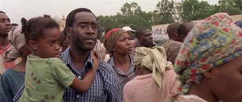 Movie still from “Hotel Rwanda” (2004), directed by Terry George – A group of people standing in a field; Close Up shot, Low angle