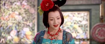 Movie still from “House of Flying Daggers” (2004), directed by Yimou Zhang – A woman with a red flower in her hair; Close Up shot, High angle
