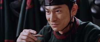 Movie still from “House of Flying Daggers” (2004), directed by Yimou Zhang – A person holding a spoon; Close Up shot, Low angle
