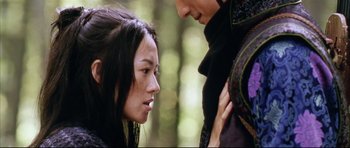 Movie still from “House of Flying Daggers” (2004), directed by Yimou Zhang – A woman and a man standing next to each other; Close Up shot, Over the shoulder angle