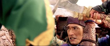 Movie still from “House of Flying Daggers” (2004), directed by Yimou Zhang – A person with a hat on; Close Up shot, High angle