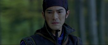 Movie still from “House of Flying Daggers” (2004), directed by Yimou Zhang – A person wearing a hat; Close Up shot, Over the shoulder angle