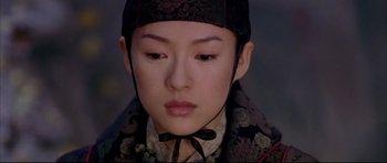 Movie still from “House of Flying Daggers” (2004), directed by Yimou Zhang – A person wearing a hat; Close Up shot, High angle