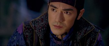 Movie still from “House of Flying Daggers” (2004), directed by Yimou Zhang – A person wearing a hat; Close Up shot, Over the shoulder angle