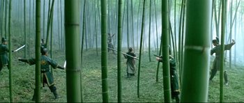 Movie still from “House of Flying Daggers” (2004), directed by Yimou Zhang – A group of people standing in the middle of a forest; Extreme Wide shot, High angle