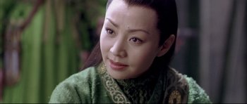 Movie still from “House of Flying Daggers” (2004), directed by Yimou Zhang – A person wearing a green outfit; Close Up shot, Over the shoulder angle