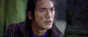 Movie still from “House of Flying Daggers” (2004), directed by Yimou Zhang – A person with long black hair; Close Up shot, Over the shoulder angle