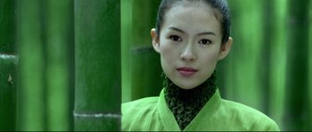 Movie still from “House of Flying Daggers” (2004), directed by Yimou Zhang – A woman in a green shirt and a green scarf; Close Up shot, Over the shoulder angle
