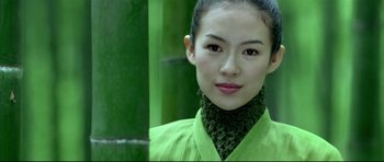 Movie still from “House of Flying Daggers” (2004), directed by Yimou Zhang – A woman in a green shirt and a green scarf; Close Up shot, Over the shoulder angle