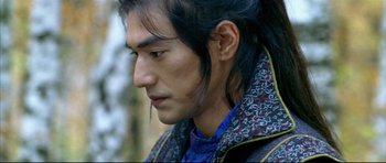 Movie still from “House of Flying Daggers” (2004), directed by Yimou Zhang – A person with long black hair; Close Up shot, Over the shoulder angle