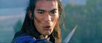 Movie still from “House of Flying Daggers” (2004), directed by Yimou Zhang – A person with long black hair; Close Up shot, Over the shoulder angle