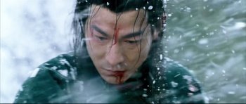 Movie still from “House of Flying Daggers” (2004), directed by Yimou Zhang – A person with blood on their face; Close Up shot, High angle