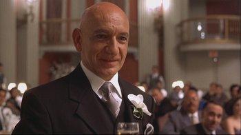 Movie still from “House of Sand and Fog” (2003), directed by Vadim Perelman – A man in a suit and tie holding a glass of wine; Close Up shot, Low angle