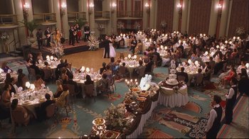 Movie still from “House of Sand and Fog” (2003), directed by Vadim Perelman – A large group of diners are sitting around a banquet hall; Extreme Wide shot, High angle
