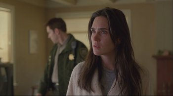Movie still from “House of Sand and Fog” (2003), directed by Vadim Perelman – A man and a woman standing next to each other in a room; Close Up shot, Low angle