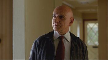 Movie still from “House of Sand and Fog” (2003), directed by Vadim Perelman – A bald man wearing a jacket and a tie; Close Up shot, Low angle