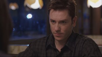 Movie still from “House of Sand and Fog” (2003), directed by Vadim Perelman – A person wearing a plaid shirt; Close Up shot, Over the shoulder angle