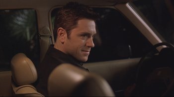 Movie still from “House of Sand and Fog” (2003), directed by Vadim Perelman – A person sitting in a car; Close Up shot, Over the shoulder angle
