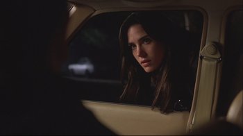 Movie still from “House of Sand and Fog” (2003), directed by Vadim Perelman – A woman sitting in the back seat of a car; Close Up shot, Over the shoulder angle