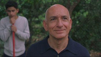 Movie still from “House of Sand and Fog” (2003), directed by Vadim Perelman – An older man with a shaved head and a blue shirt; Close Up shot, Low angle