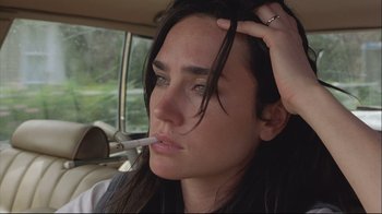 Movie still from “House of Sand and Fog” (2003), directed by Vadim Perelman – A person in a car smoking a cigarette; Close Up shot, Low angle