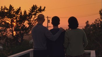 Movie still from “House of Sand and Fog” (2003), directed by Vadim Perelman – A group of people standing next to each other on a deck; Wide shot, High angle