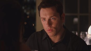 Movie still from “House of Sand and Fog” (2003), directed by Vadim Perelman – A person sitting at a table; Close Up shot, Over the shoulder angle