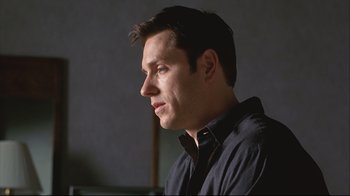 Movie still from “House of Sand and Fog” (2003), directed by Vadim Perelman – A person wearing a black shirt; Close Up shot, Low angle