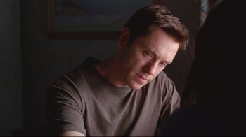 Movie still from “House of Sand and Fog” (2003), directed by Vadim Perelman – A person wearing a brown shirt; Close Up shot, Over the shoulder angle
