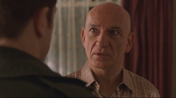 Movie still from “House of Sand and Fog” (2003), directed by Vadim Perelman – An older man with a bald head talking to a younger man; Close Up shot, Over the shoulder angle