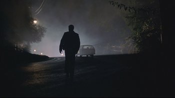 Movie still from “House of Sand and Fog” (2003), directed by Vadim Perelman – A man walking down a street at night; Wide shot, Low angle
