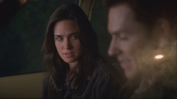 Movie still from “House of Sand and Fog” (2003), directed by Vadim Perelman – A woman sitting next to a man in a car; Close Up shot, Over the shoulder angle