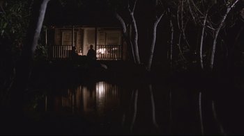 Movie still from “House of Sand and Fog” (2003), directed by Vadim Perelman – Two people sitting on a bench at night; Extreme Wide shot, High angle