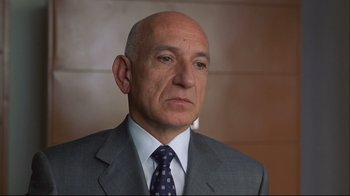 Movie still from “House of Sand and Fog” (2003), directed by Vadim Perelman – An older man in a suit and tie looking at the camera; Close Up shot, Low angle
