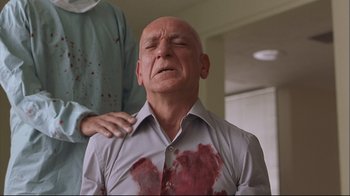 Movie still from “House of Sand and Fog” (2003), directed by Vadim Perelman – An older bald man has blood all over his shirt; Close Up shot, Low angle