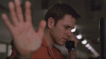 Movie still from “House of Sand and Fog” (2003), directed by Vadim Perelman – A person talking on a phone; Close Up shot, Over the shoulder angle