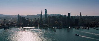 Movie still from “Venom” (2018), directed by Ruben Fleischer – A view of a city from the water with boats in the water; Extreme Wide shot, High angle