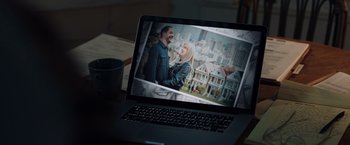 Movie still from “Venom” (2018), directed by Ruben Fleischer – A computer screen showing a man and a woman; Extreme Close Up shot, High angle