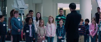 Movie still from “Venom” (2018), directed by Ruben Fleischer – A group of young people standing next to each other; Medium shot, Over the shoulder angle
