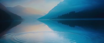 Movie still from “Venom” (2018), directed by Ruben Fleischer – A body of water with a mountain in the background; Extreme Wide shot, High angle