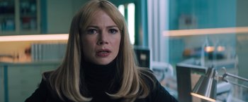 Movie still from “Venom” (2018), directed by Ruben Fleischer – A woman with long blonde hair wearing a black sweater; Close Up shot, Over the shoulder angle