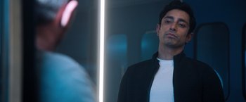 Movie still from “Venom” (2018), directed by Ruben Fleischer – A man standing in front of a bathroom mirror; Close Up shot, Over the shoulder angle